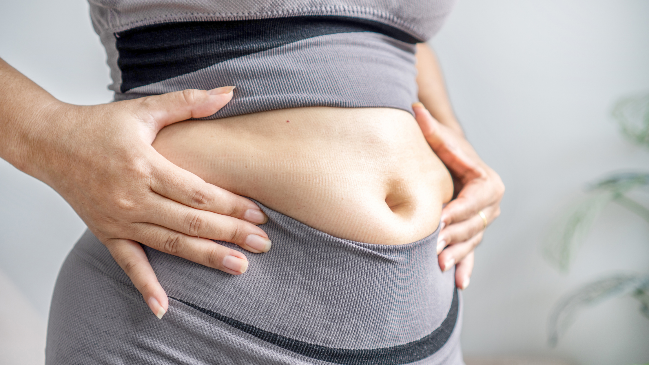 Woman with bloated belly
