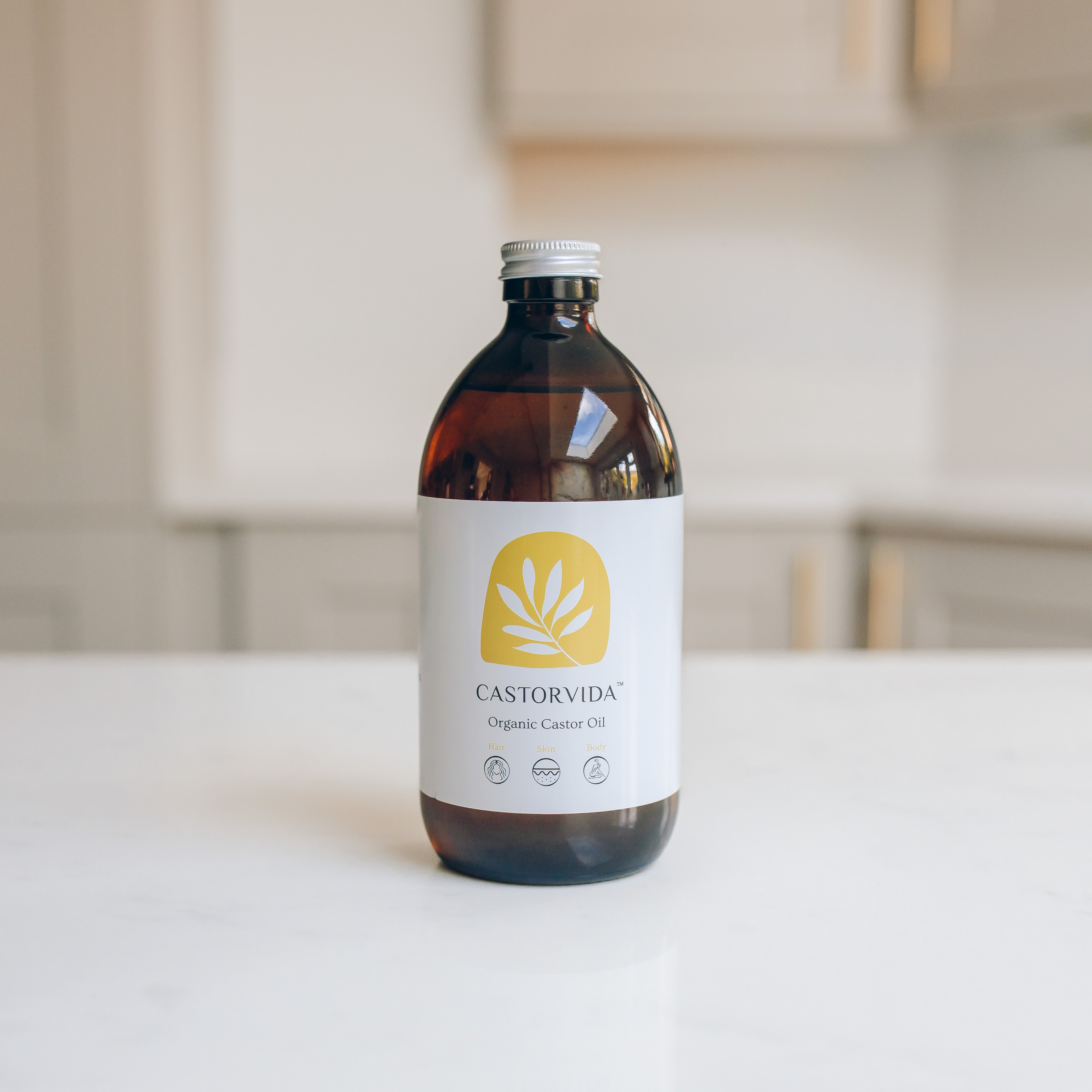 Amber glass bottle of Castorvida 500 ml organic cold‑pressed hexane‑free food‑grade castor oil sourced from India